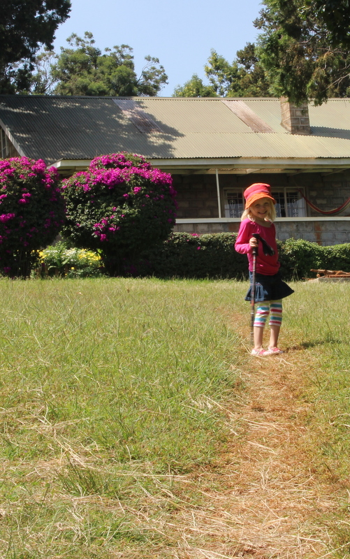 Riley, on a daddy-daughter walk to get a closer look at a colobus monkey we saw in our front yard!
