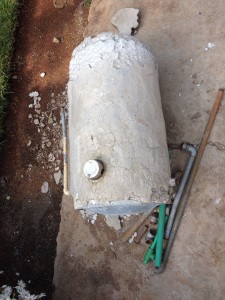 The culprit: ancient and tiny, look closely at the bottom. Originally flat, to sit on the floor, the steam pressure pushed the bottom out three inches--this engineer was fascinated by the textbook case of 'plastic deformation' of a metal.