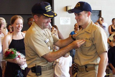 Getting my 'dolphins' (submarine warfare qualification pin) pinned on by Commanding Officer Joe Tofalo