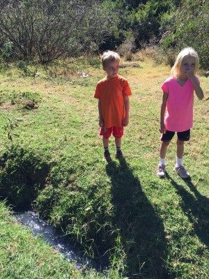 I think Riley's face says it all. This is the river of raw sewage that will soon be dry, once the plant is fully commissioned.