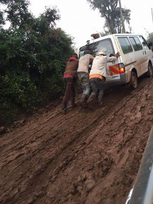 The local Maingi community out in force to help push cars, matatus, and ambulances through the mud. Some of the more enterprising youths were doing it for a bit of extra money, which was a good idea!