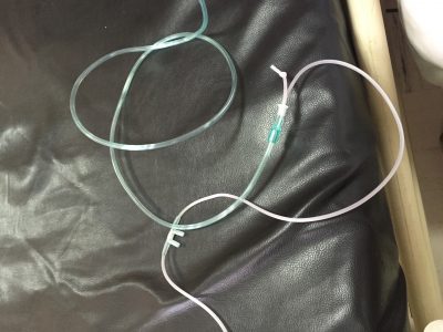 Home made CPAP - oxygen tubing, cut and knotted, extended and adapted.